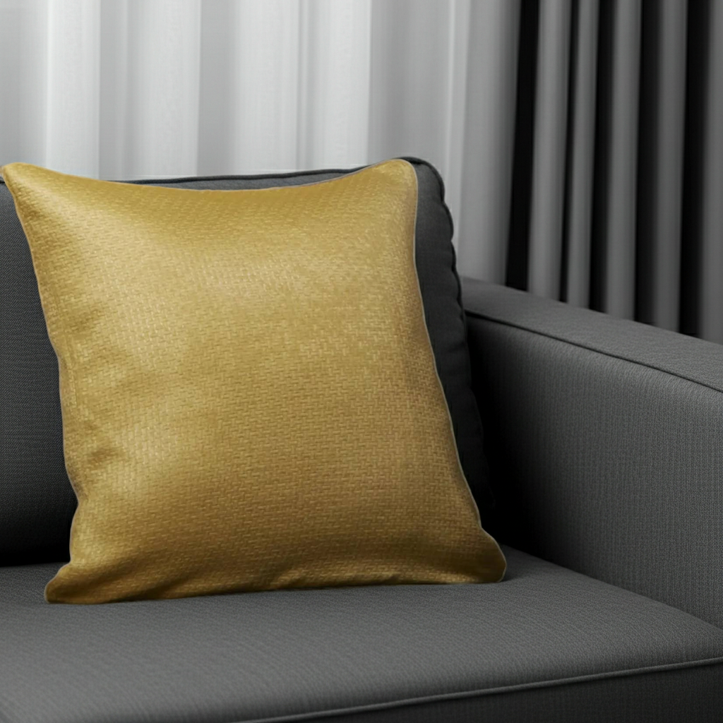 Yellow cushion cover on a gray sofa with a neutral background
