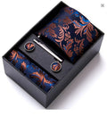 Blue and Copper gift set with blue floral tie, pocket square, cufflinks, and tie clip in a black box.