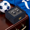 Blue sports Cufflinks in a blue gift box with a football and blue fabric in the background
