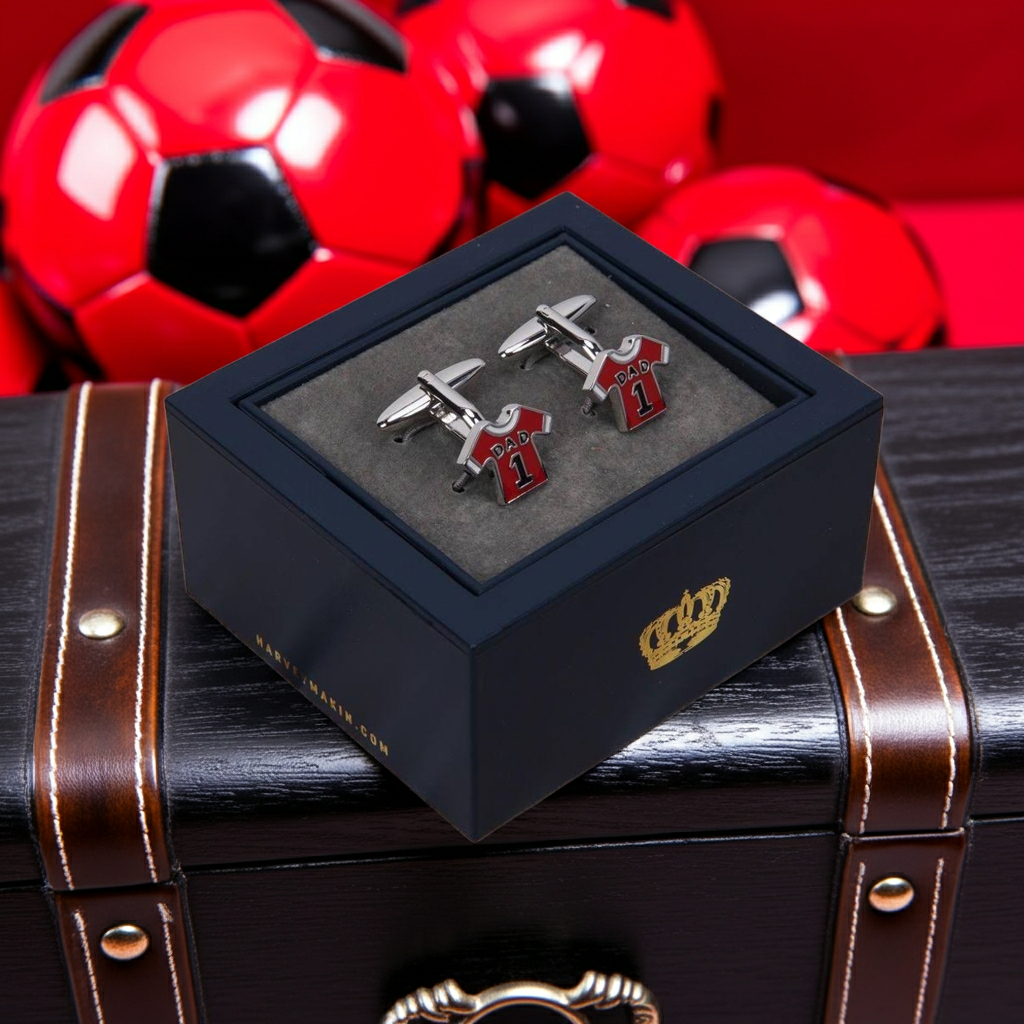 Red sports cufflinks in a blue gift box with a red background