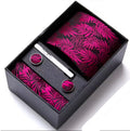 Fuscia  pink patterned tie, pocket square, and cufflinks in a black box on a white background