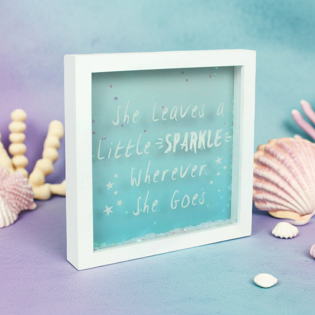 Framed mermaid/ fairy themed quote with decorative shells on a gradient background