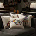 Decorative pillows with musical instrument designs on a gray couch in a music-themed room.