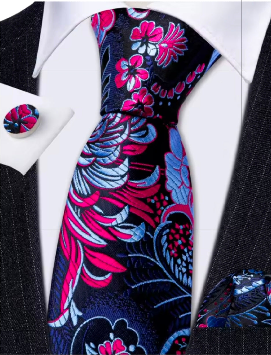 Pinka dn Blue floral patterned tie with matching pocket square on a suit jacket
