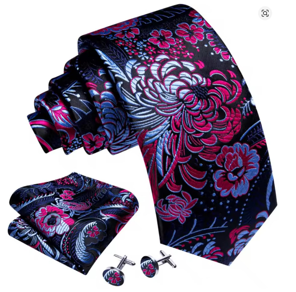 Pink and Purple floral patterned tie, pocket square, and cufflinks set on a white background