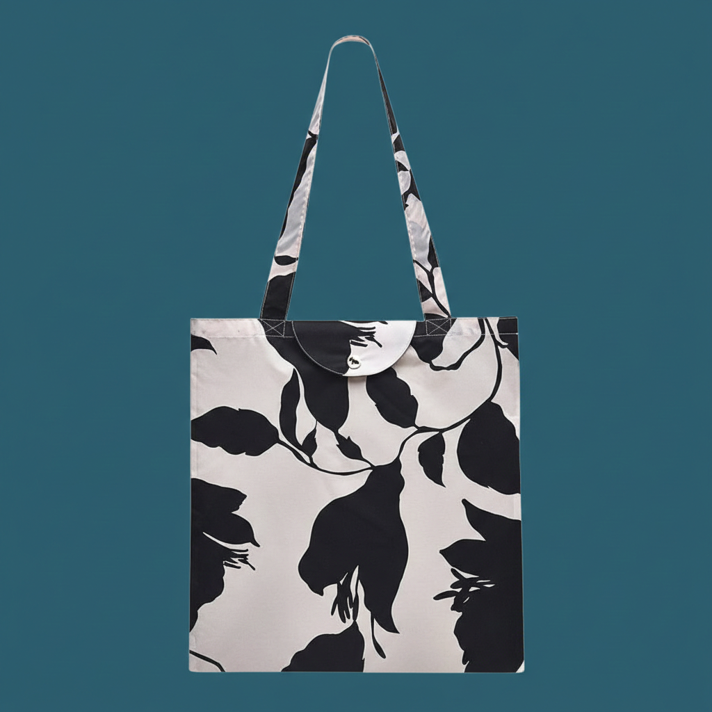 Radley Tote bag with black and white floral pattern on a teal background