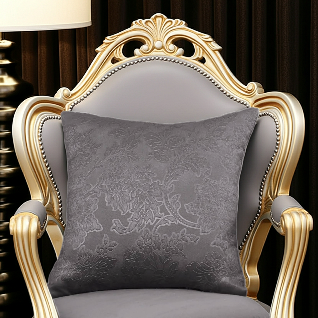 Decorative gray cushion on an ornate chair with gold accents