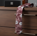 Ted Baker Floral-patterned tie on a wooden surface