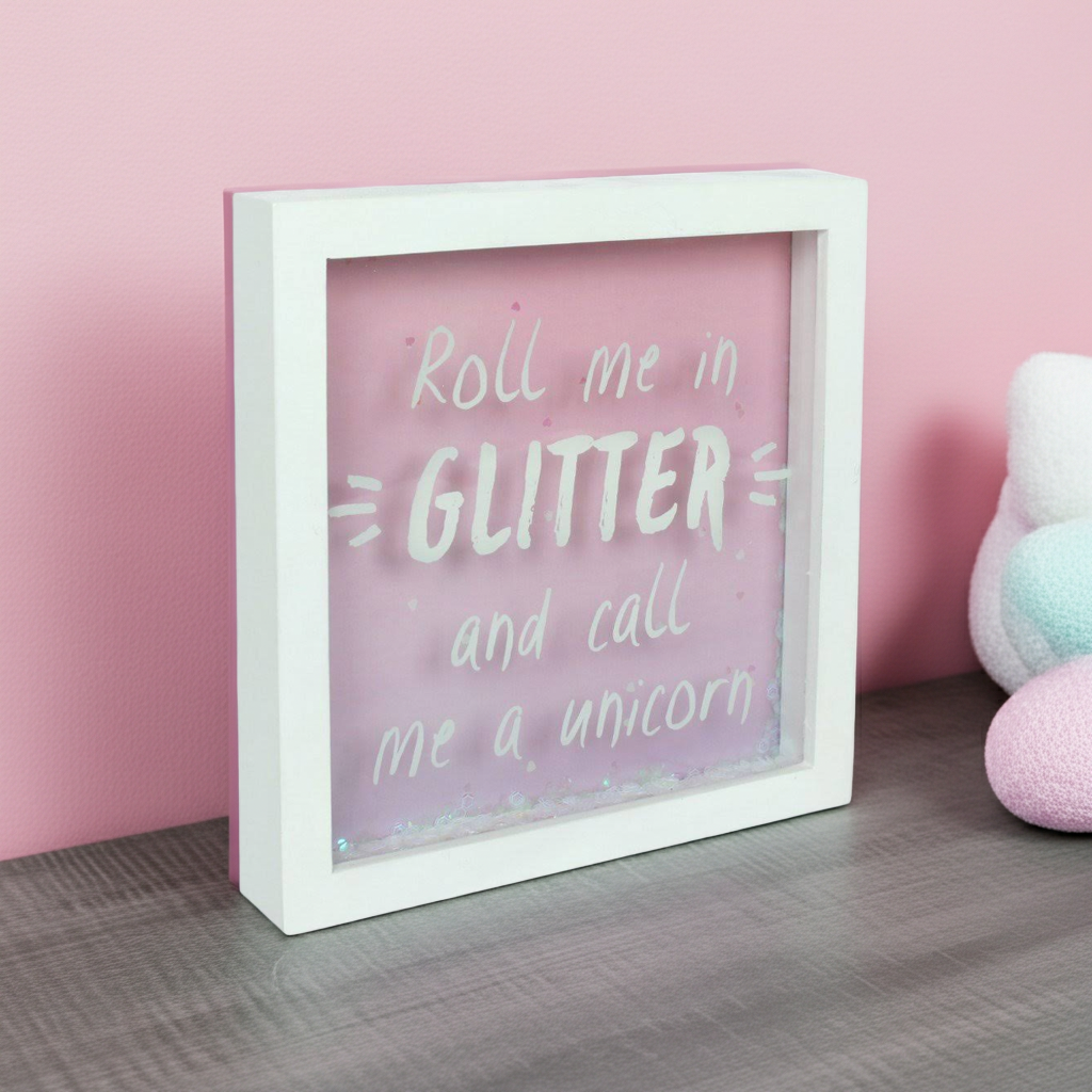 Decorative box with 'Roll me in GLITTER and call me a unicorn' text on a pink background