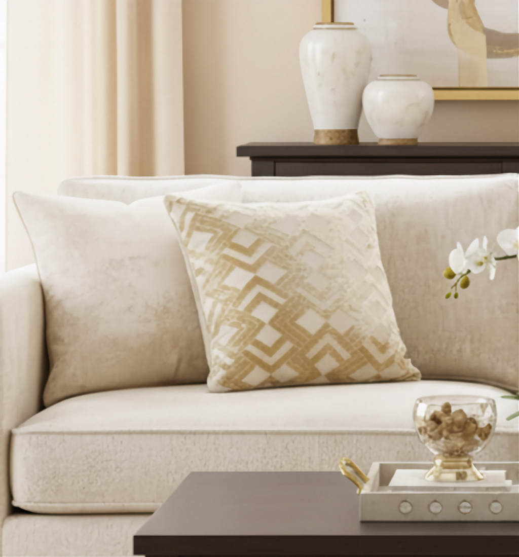 Beige sofa with decorative beige cushions in a living room setting