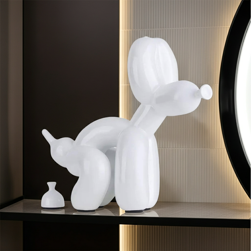 White balloon dog pooping sculpture on a dark surface with a neutral wall background