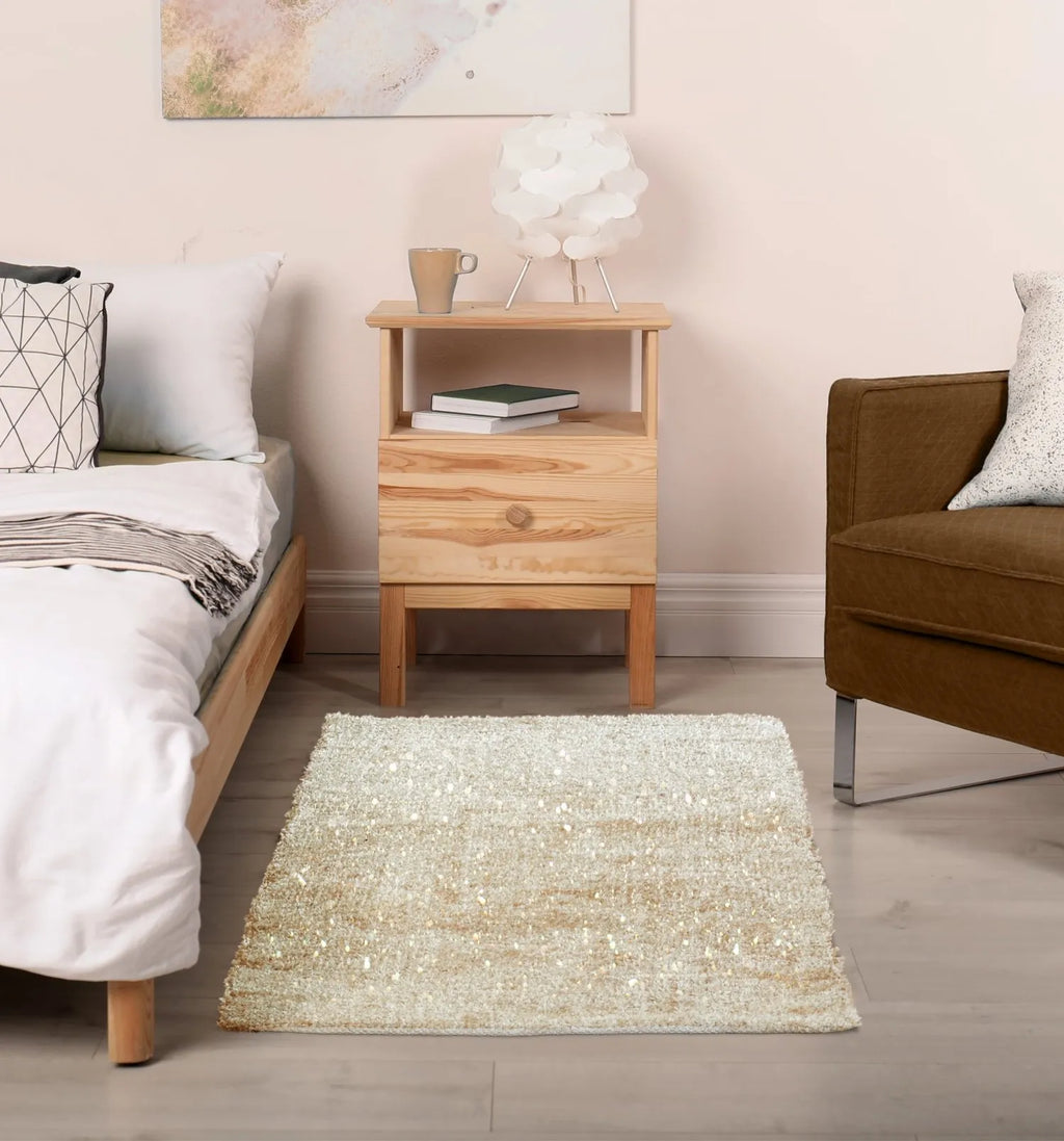 Sparkeles Beige rug shown in a bedroom.